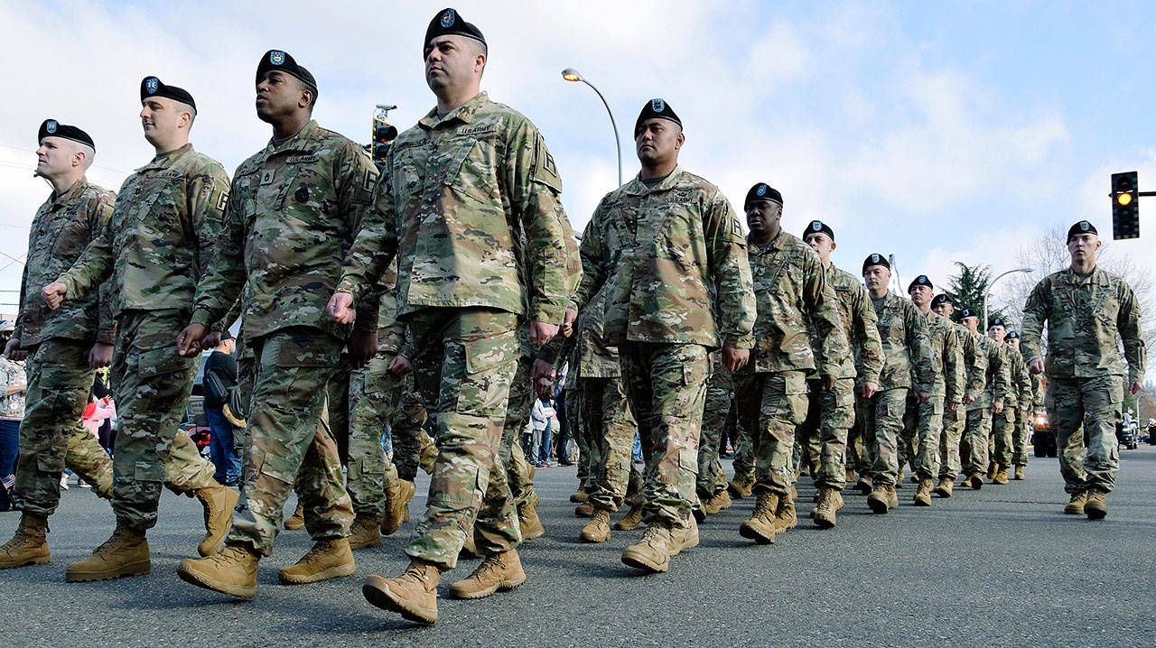 A U.S. Army unit marches down Main Street during the Auburn Veterans Parade on Saturday. RACHEL CIAMPI, Auburn Reporter