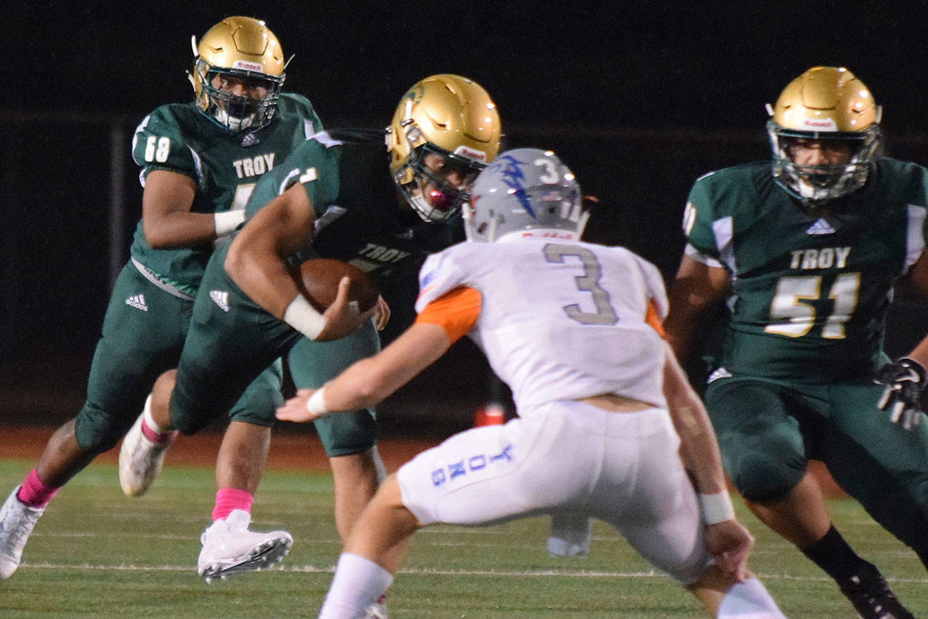 Auburn quarterback Calvin Liulamaga runs against Auburn Mountainview during the Trojans’ 37-29 win on Oct. 5. League coaches chose Liulamaga as the NPSL Valley Division All-Purpose Player of the Year. RACHEL CIAMPI, Auburn Reporter