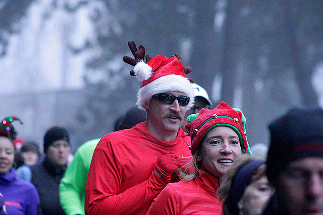 Runners dressed for the occasion take off in Kent’s annual Christmas Rush Fun Run last year. The 10K run and 5K run/walk return to the Kent streets on Saturday, Dec. 8. MARK KLAAS, Kent Reporter