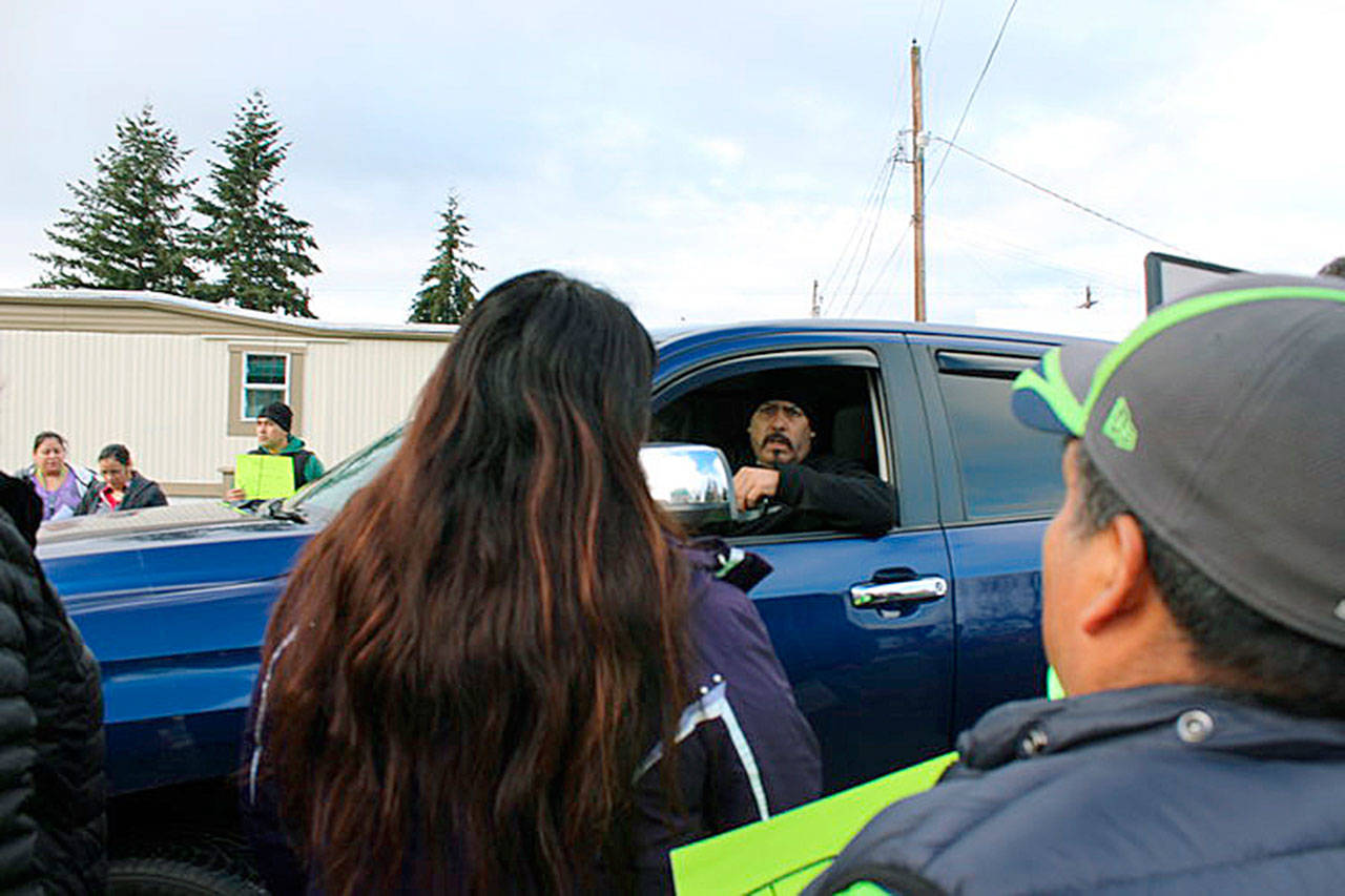Residents of Laurelwood Mobile Home Park in South Auburn hand resident manager Jose M. Guardado a letter addressed to property manager Andrew Cho, listing complaints against Guardado, whom they accuse of a pattern of abusive behavior. COURTESY PHOTO, Washington CAN