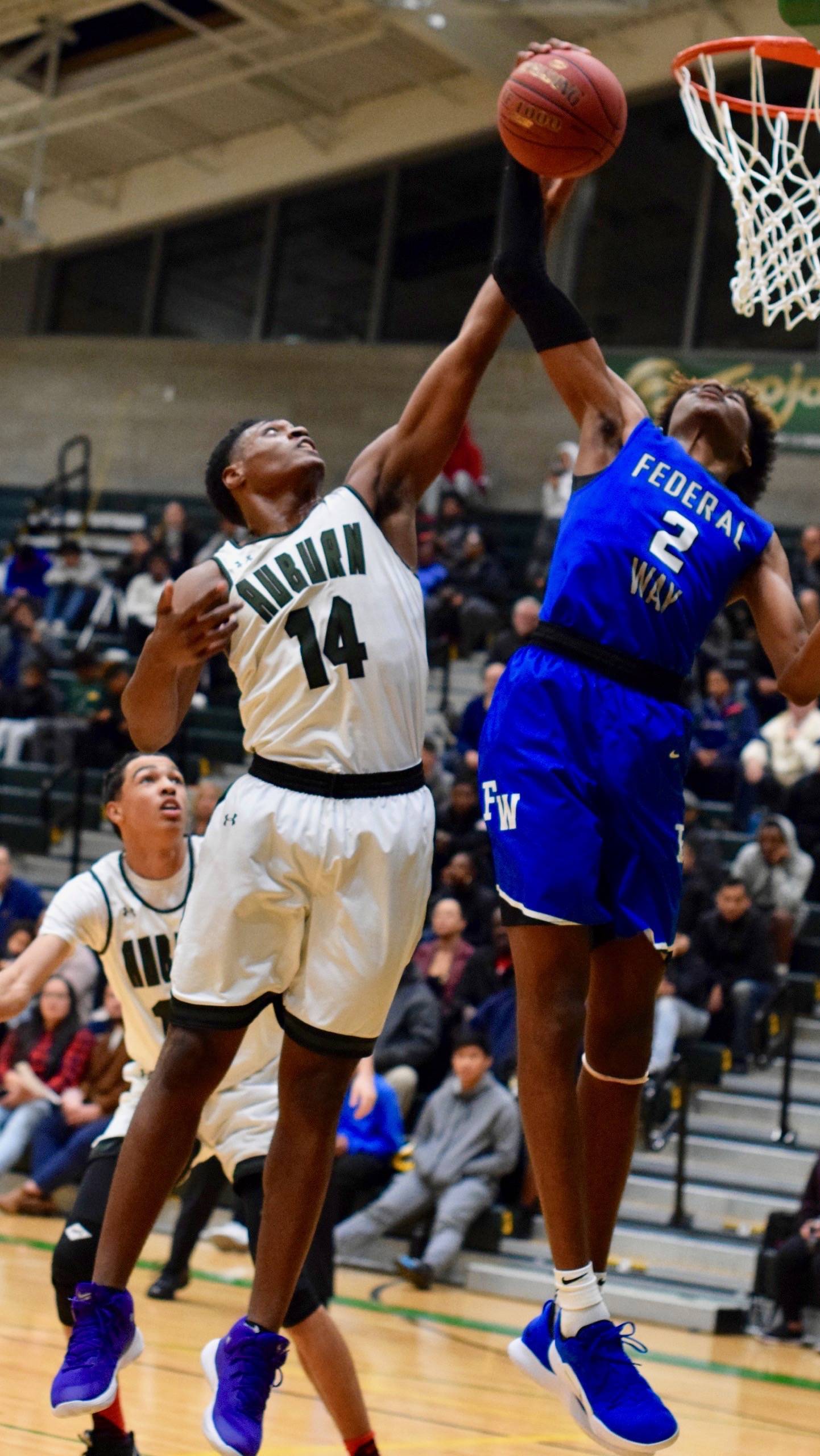 Auburn’s Isaiah Dunn and Federal Way’s Jaden McDaniels battle for a rebound during NPSL Olympic Division play Thursday night. RACHEL CIAMPI, Auburn Reporter