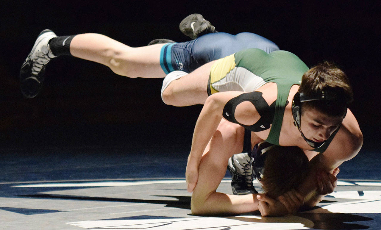 Auburns Gabe Sena, here battling Auburn Riversides Justin Pritchard last season, returns to make another run at the state meet. RACHEL CIAMPI, Auburn Reporter