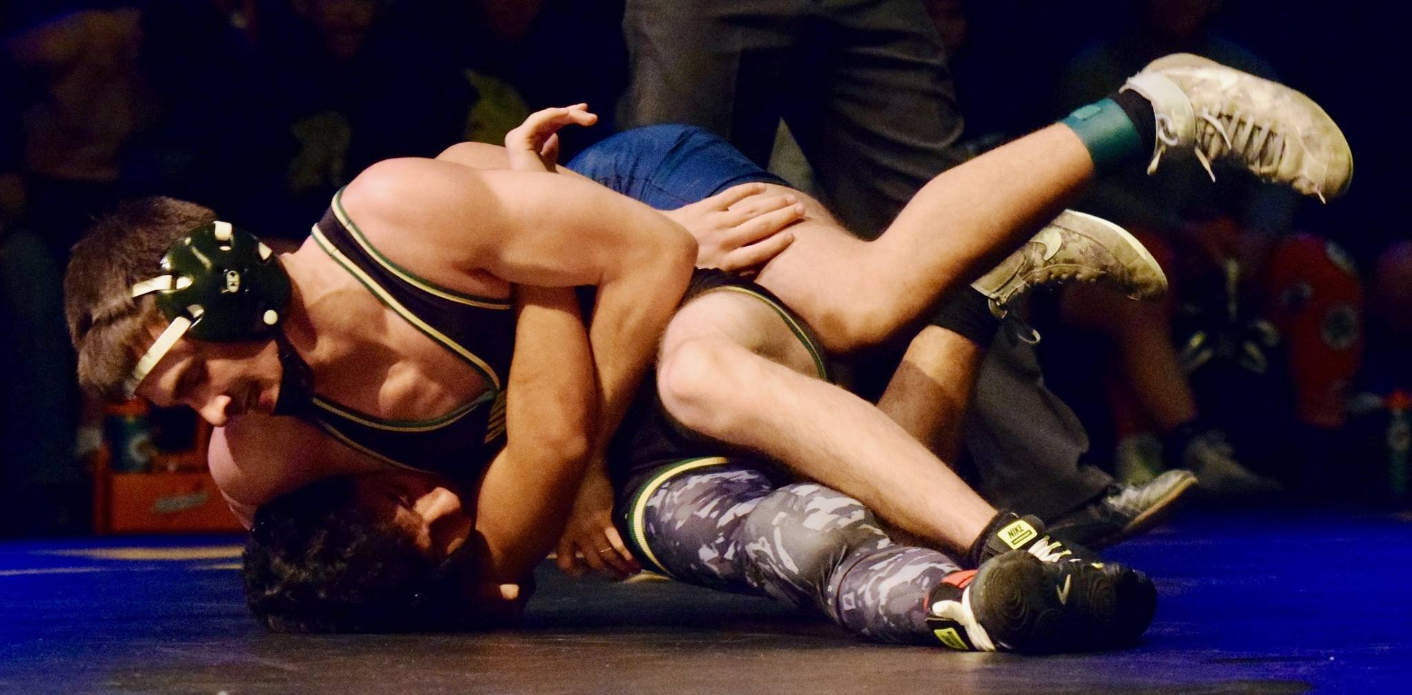 Auburn’s Gabe Sena rides Todd Beamer’s Julian Clemans before delivering a pin in the second round of their 132-pound match last Wednesday, Jan. 9, at the Auburn Performing Arts Center. RACHEL CIAMPI, Auburn Reporter