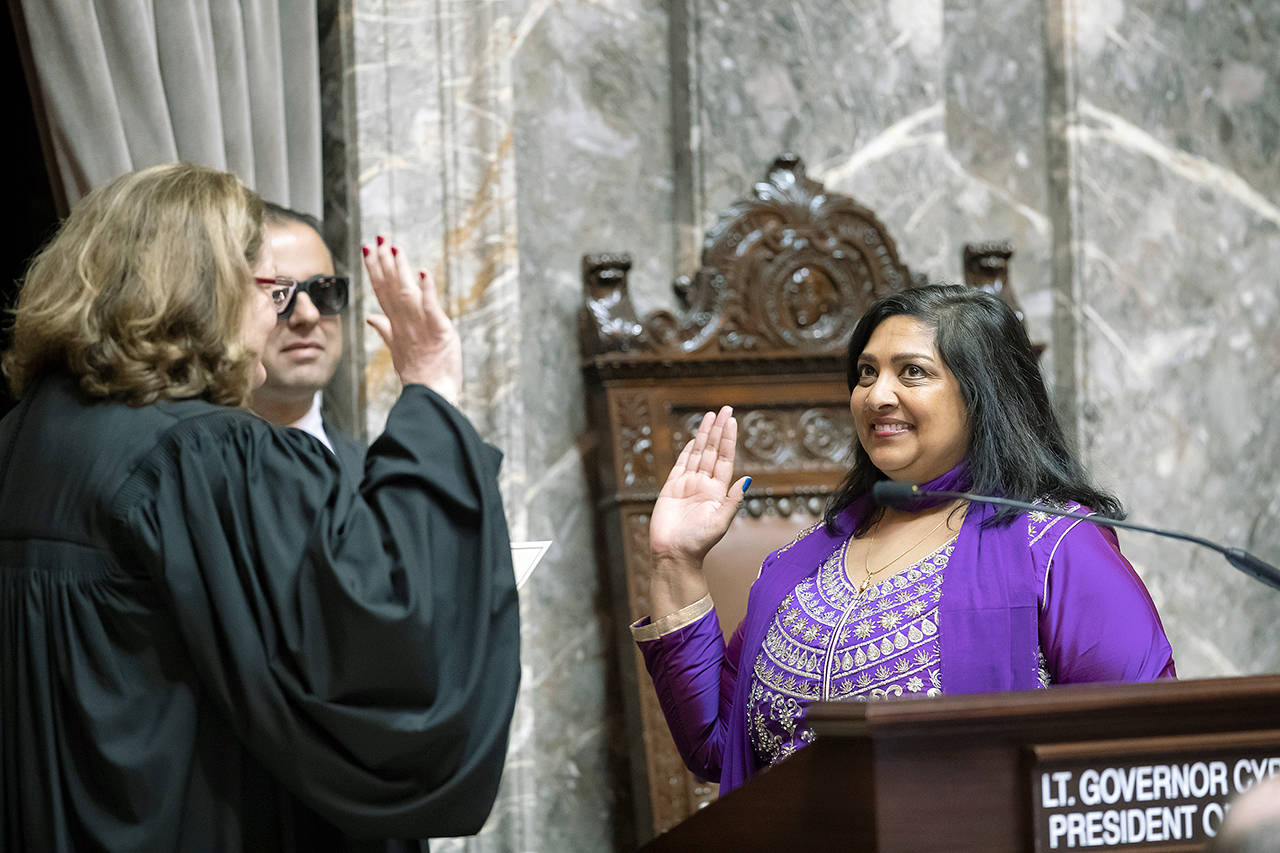 Sen. Mona Das, D-Covington, right, is sworn into the Washington State Senate by State Supreme Court Chief Justice Mary Fairhurst on Monday. COURTESY PHOTO, Washington State Senate