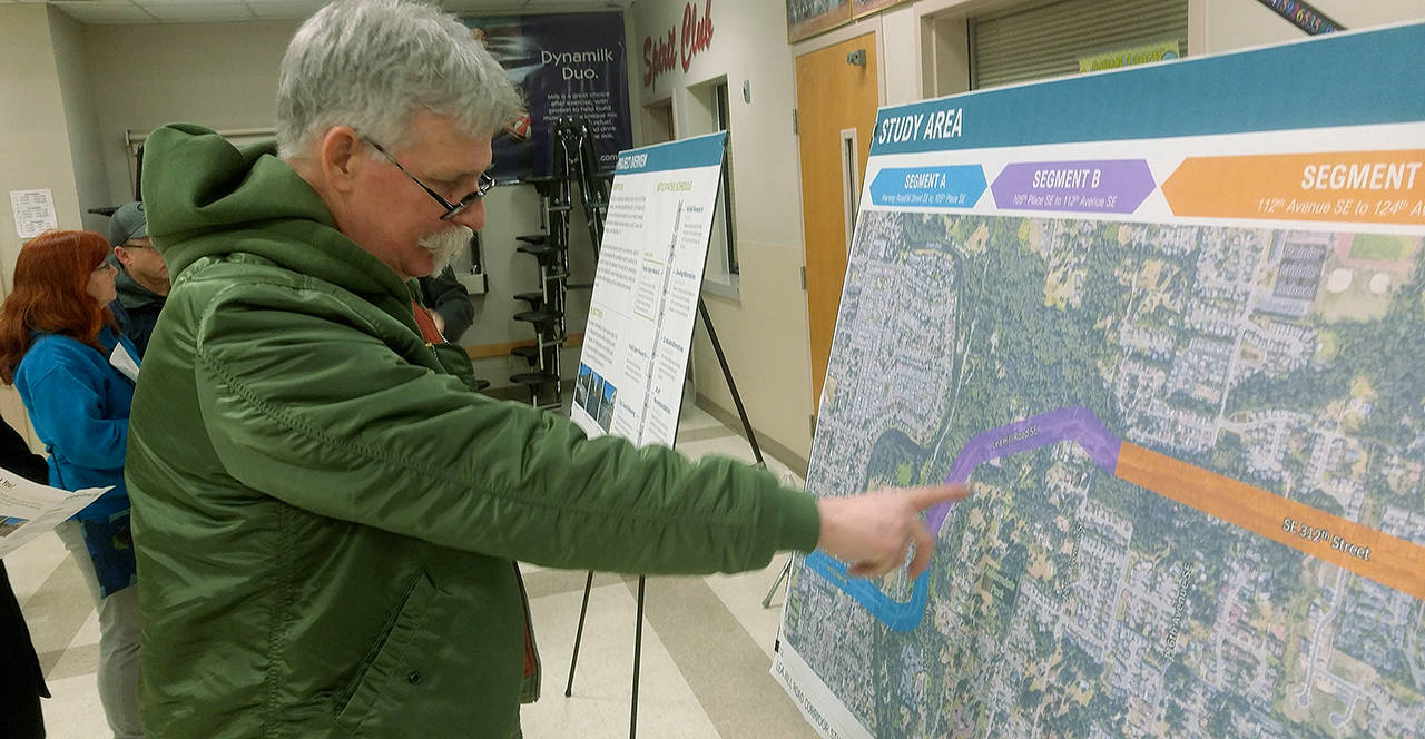 Lee Hill resident Russ Campbell indicates areas of concern along the Lea Hill Corridor last week during a fact-finding, idea-ferreting city forum at Rainier Middle School. ROBERT WHALE, Auburn Reporter