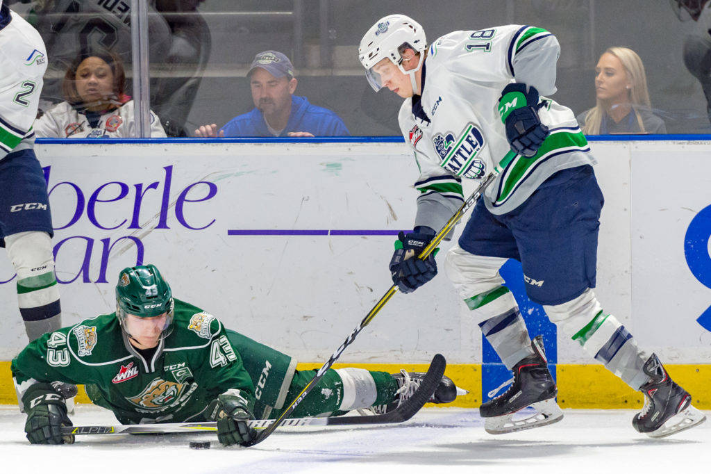 The Thunderbirds’ Andrej Kukuca tries to advance the back past fallen Silvertip Connor Dewar during WHL action at the accesso ShoWare Center on Friday night. COURTESY PHOTO, Brian Liesse, T-Birds