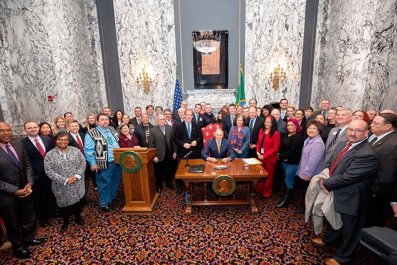 More than 50 people joined Gov. Jay Inslee as he signed House Bill 1064 into law Monday. COURTESY PHOTO, Legislative Support Services