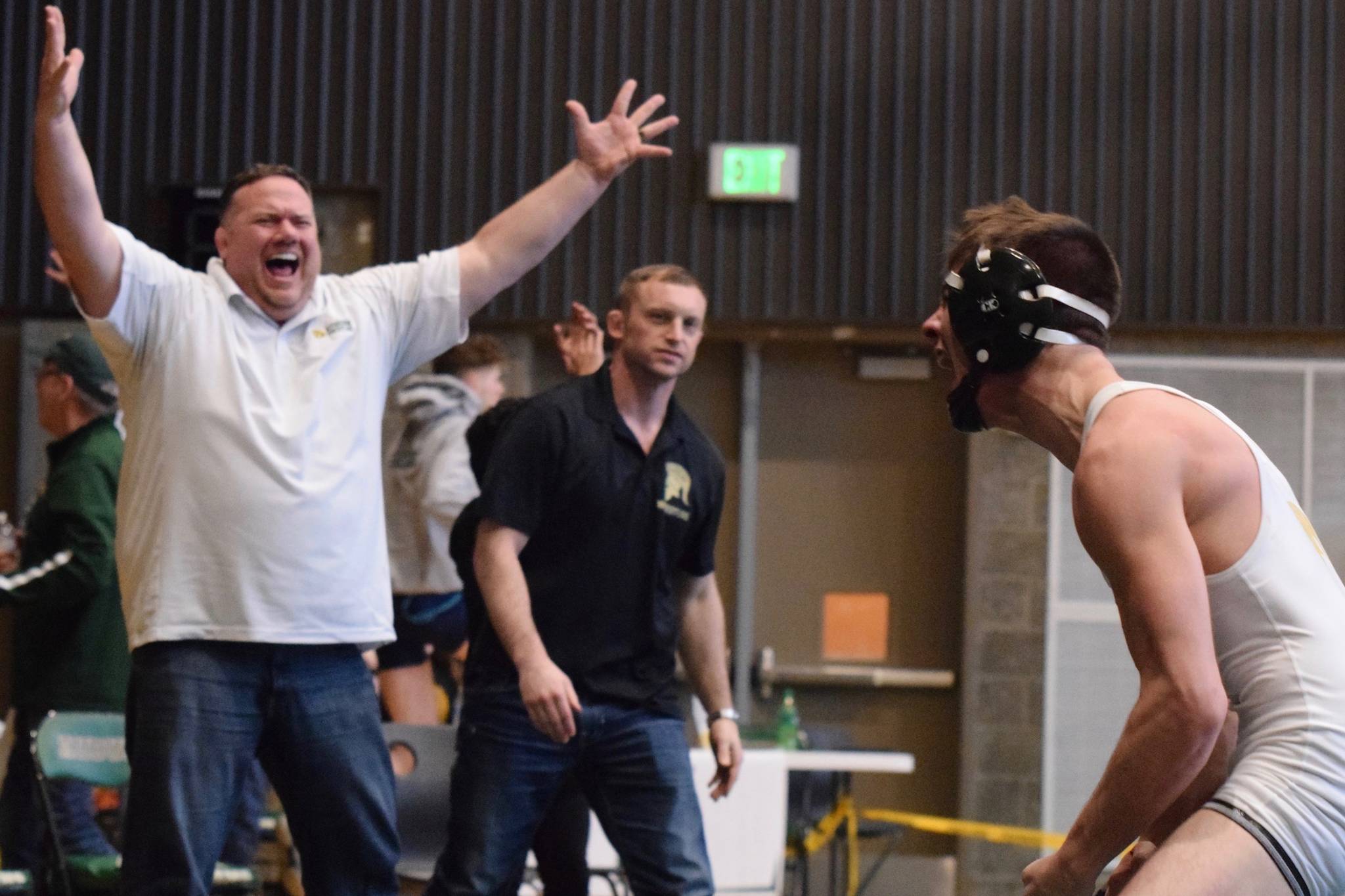 Auburn coach Matt Hoover exults after his 132-pound wrestler, Gabe Sena, reversed his opponent and pinned him before the second-round buzzer sounded to win his weight class during the NPSL Olympic Division/sub-district tournament championship on Feb. 2. Sena qualified for the regionals, which were canceled last Friday because of storm conditions. A revised state tounament is on for this weekend. RACHEL CIAMPI, Auburn Reporter