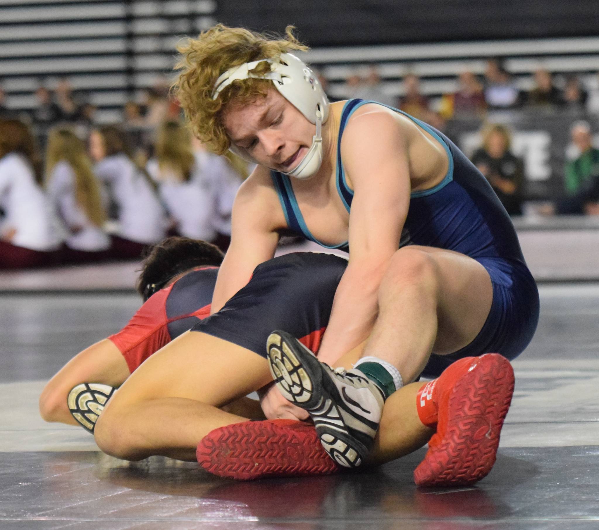 Auburn Riversides Jaden Cassel tries to turn Sunnysides E.J. Villanueva during their 113-pound championship bout at Mat Classic XXXI in the Tacoma Dome on Saturday. Villanueva prevailed, 7-2. RACHEL CIAMPI, Auburn Riverside.