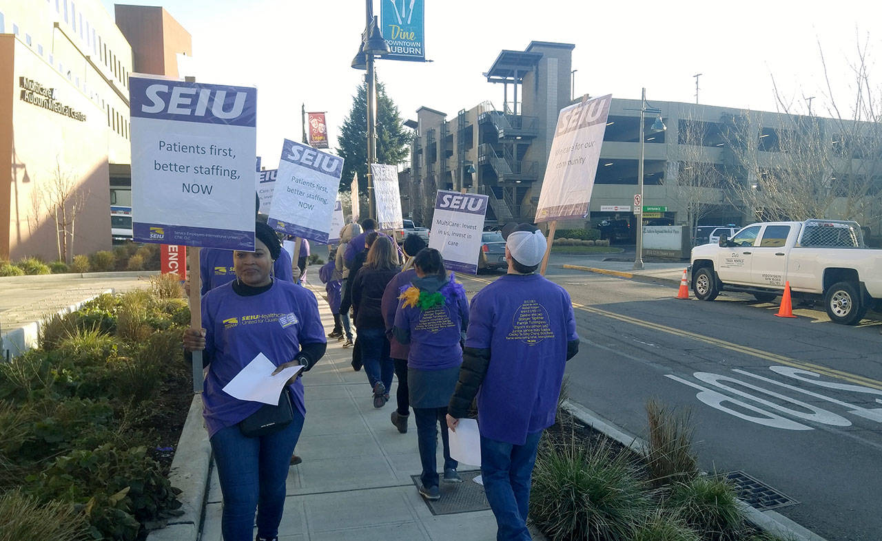 Outside of Multicare Auburn Medical Center’s emergency room entrance, dissatisfied hospital employees, members of SEIU 1199, picket to inform the community of the issues that separate them from hospital administration in their ongoing negotiations for a new contract. ROBERT WHALE, Auburn Reporter
