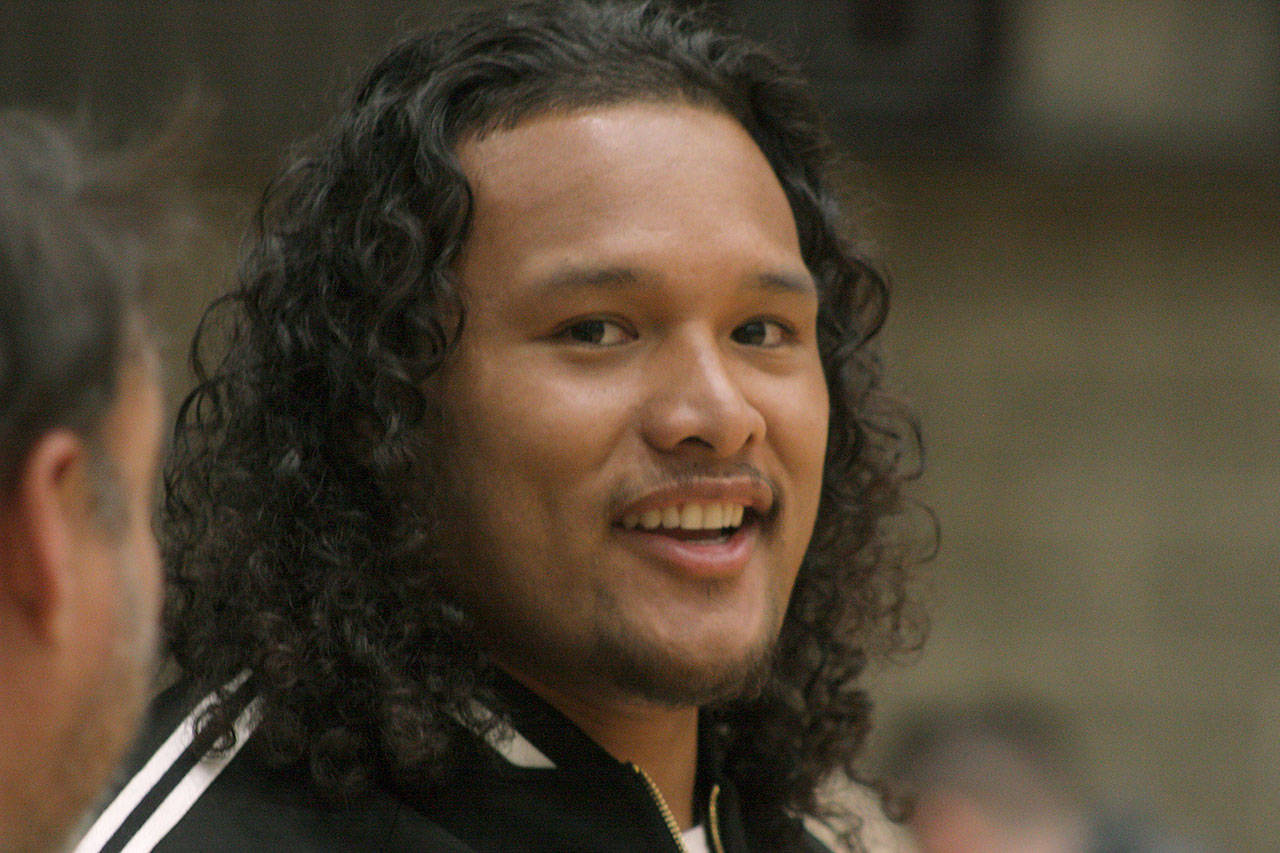 NFL defensive lineman Danny Shelton talks to friends prior to tipoff at the Sterling Athletics South Sound All-Star Game at Auburn High School’s Bob Jones Gymnasium last Friday night. Shelton, an Auburn alumnus, former Husky and a member of the Super Bowl champion New England Patriots, came home to be a celebrity coach for one of the all-star teams. MARK KLAAS, Auburn Reporter