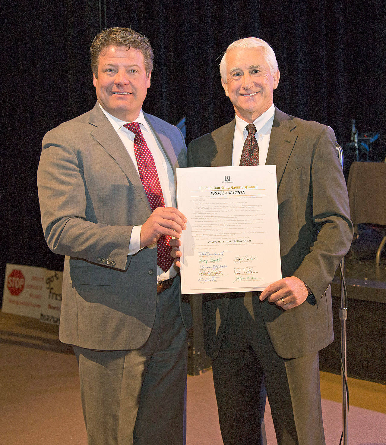 King County Councilmember Reagan Dunn, left, presents former Congressman Dave Reichert with a proclamation, declaring Wednesday, March 20 as Dave Reichert Day. COURTESY PHOTO