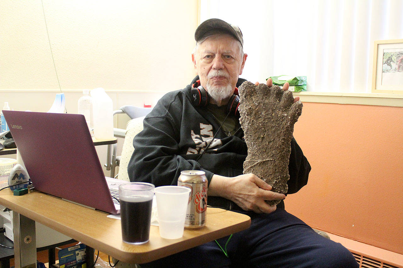 Thom Cantrell, one of the organizers of the upcoming International Conference for Primal People, holds up a mold of a Sasquatch footprint. He said the mold was taken in the Blue Mountains in Oregon by Paul Freeman, a well-known Sasquatch hunter who’s 1994 footage of a Sasquatch in that area made big waves in the believer and skeptic communities alike. Photo by Ray Miller-Still