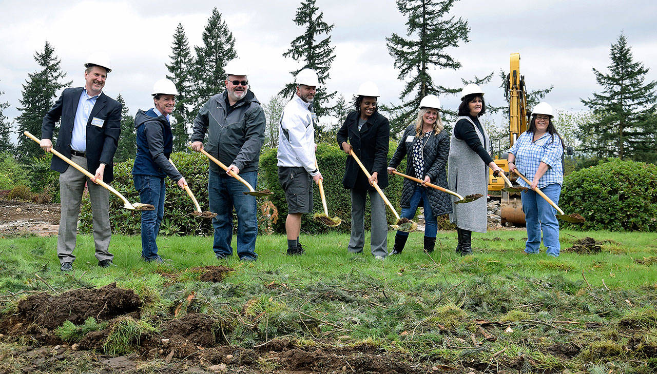 School and project leaders gather for the official groundbreaking of Auburn’s 15th elementary school on acreage off Kersey Way Southeast. Those represented at the shovel ceremony last Saturday are, from left: Bob Lindstrom of BLRB Architects, Tacoma; Brock McNally of Absher Construction Company, Puyallup; Auburn School District Superintendent Alan Spicciati; school board president Ryan Van Quill; school board members Robyn Mulenga and Laurie Bishop; Evergreen Heights Elementary School Principal Anne Gayman; and school board member Laura Theimer. RACHEL CIAMPI, Auburn Reporter