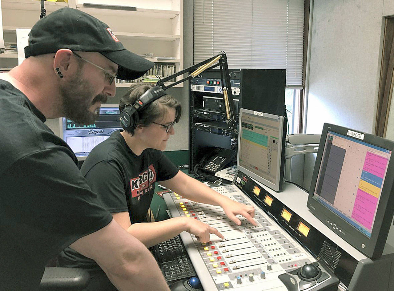 Green River College student Natalie Holcomb, right, cues up the next song in the KGRG-FM studio, with Chris Wilson, a student and the radio station’s assistant program director, monitoring the sound. Holcomb, who is finishing her time at the college, has worked part-time in the promotion department at the local Entercom Radio stations (KISW, KNDD, Hot 103.7, The Wolf, 94.1 The Sound). COURTESY PHOTO, KGRG-FM