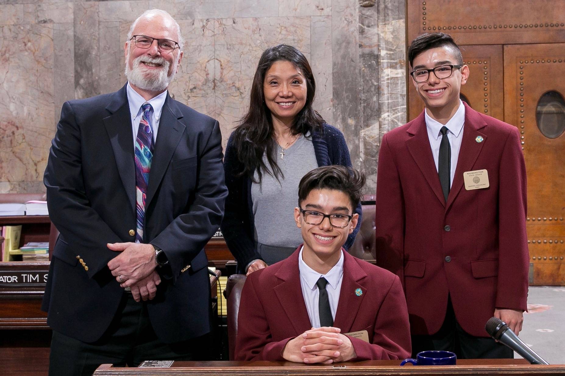 Sen. Fortunato with Senate Pages Matthew (front), Daniel (right), and their mother, Ning. COURTESY PHOTO, Washington State Legislature