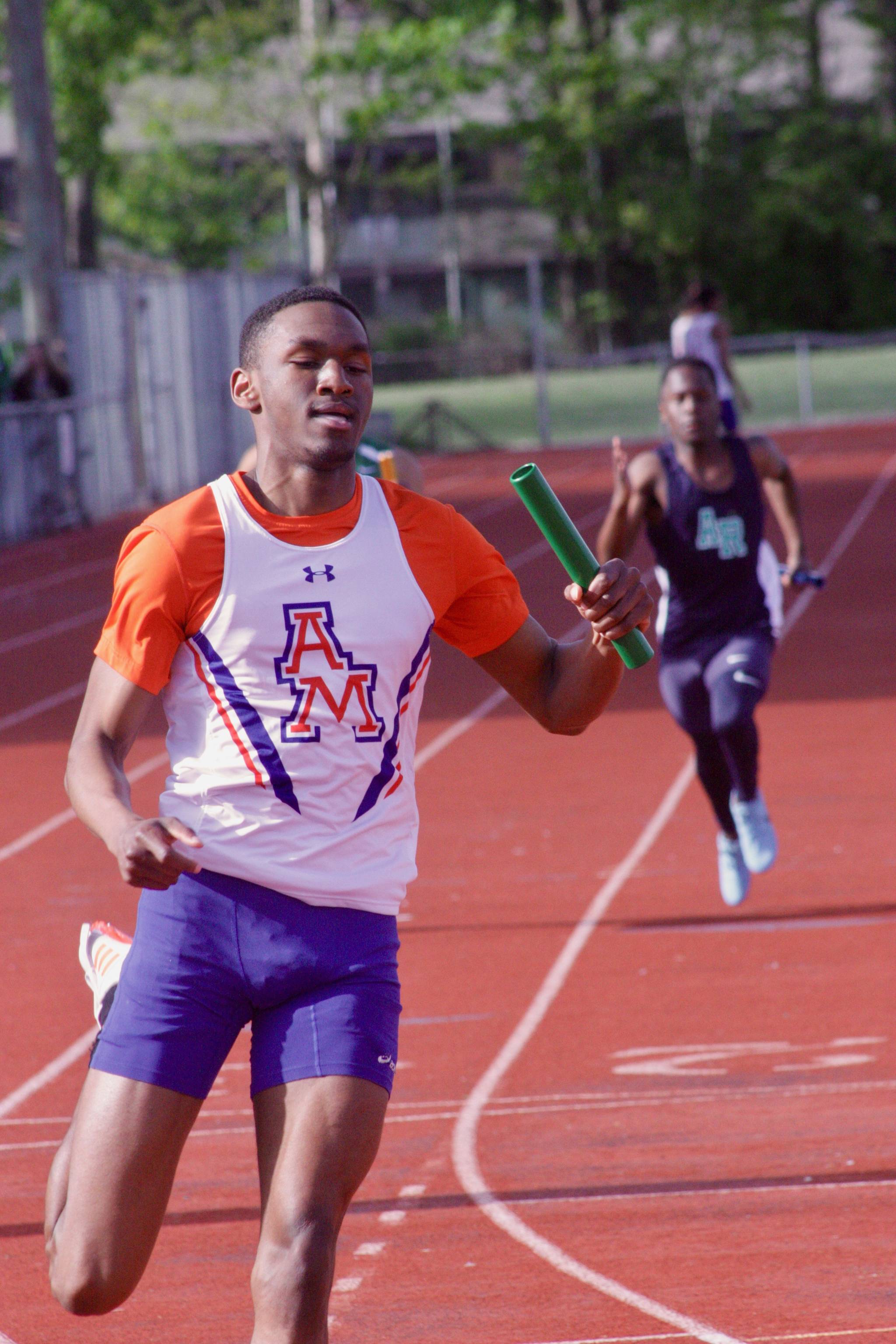 Chris Penn anchors Auburn Mountainview’s 400-meter relay to victory at the Auburn All-City track and field finals on Thursday. The Lions won in 43.24 seconds, the fifth-fastest time among 4A schools this year. MARK KLAAS, Auburn Reporter