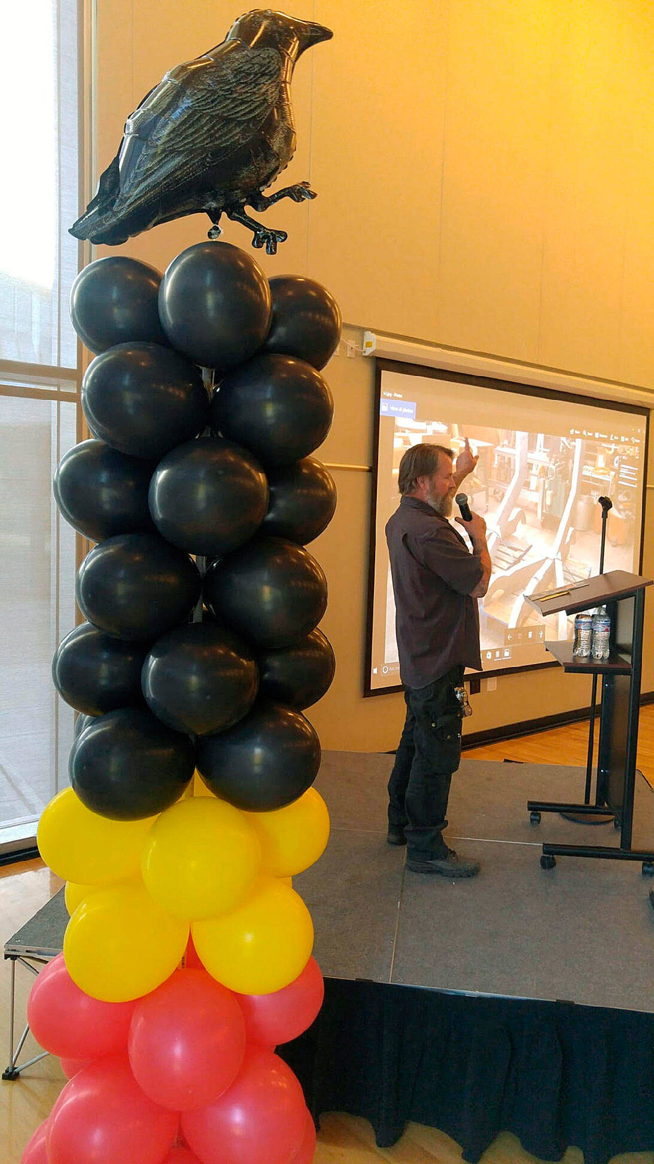 Crow With Fries artist Peter Reiquam speaks to the audience during an artist reception at the Auburn Community and Event Center on May 1. Reiquam is sculpting the city-commissioned public art piece that will land at Les Gove Park on May 31. ROBERT WHALE, Auburn Reporter