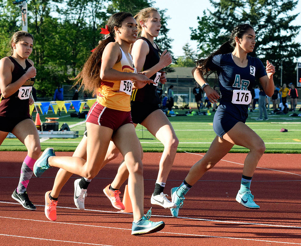 Auburn Riverside sophomore Jasmin Muneton, far right, paces the pack in the NPSL 3,200-meter final at Auburn Memorial Stadium on May 9. Muneton finished second in the race in 11 minutes, 46.07 seconds. She was seventh in the 1,600 at 5:26.93. RACHEL CIAMPI, Reporter