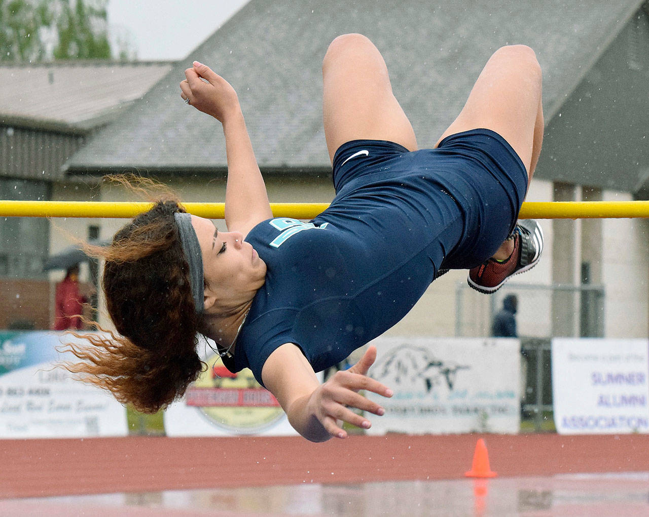 Auburn Riverside’s Alaya Hill soars in the high jump at the 4A WCD meet. Hill won the district title with a leap of 5 feet, 2 inches. RACHEL CIAMPI, Auburn Reporter