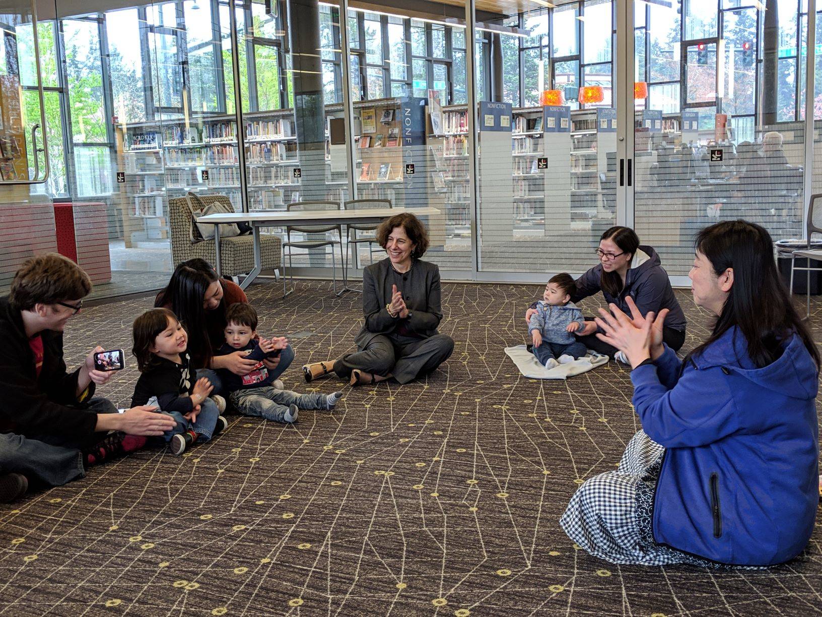 Lisa Rosenblum, executive director of the King County Library System, joins families for Story Time. COURTESY PHOTO, KCLS