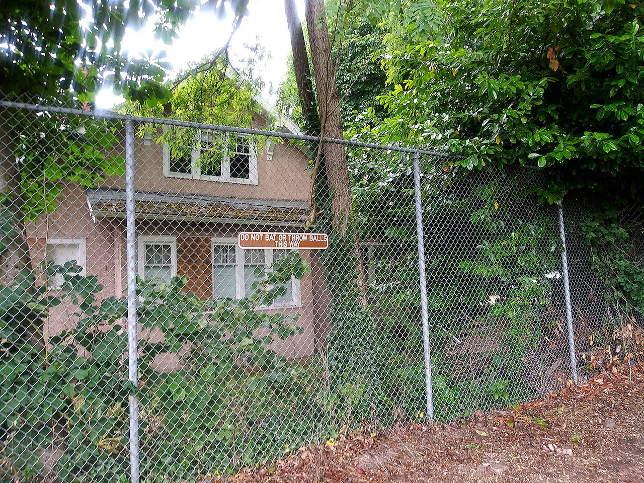 The property at 610 M St. NE on which a California developer is proposing to put an Enhanced Services Facility to house patients released from state or local psychiatric hospitals in preparation to reenter society is just beyond this fence, in the northeast corner of Fulmer Park, and immediately south of the Church of Jesus Christ of Latter-day Saints. ROBERT WHALE, Auburn Reporter