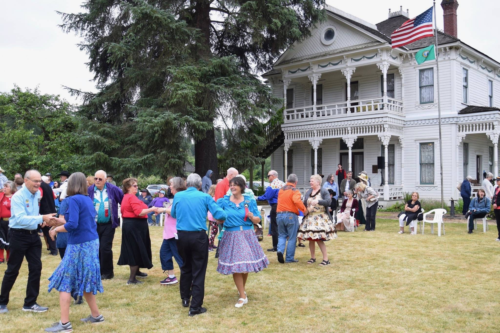 The Washington State Square and Folk Dance Federation performs in front of the Neely Mansion during a community celebration – the 125th anniversary of the historic home Saturday. RACHEL CIAMPI, Auburn Reporter