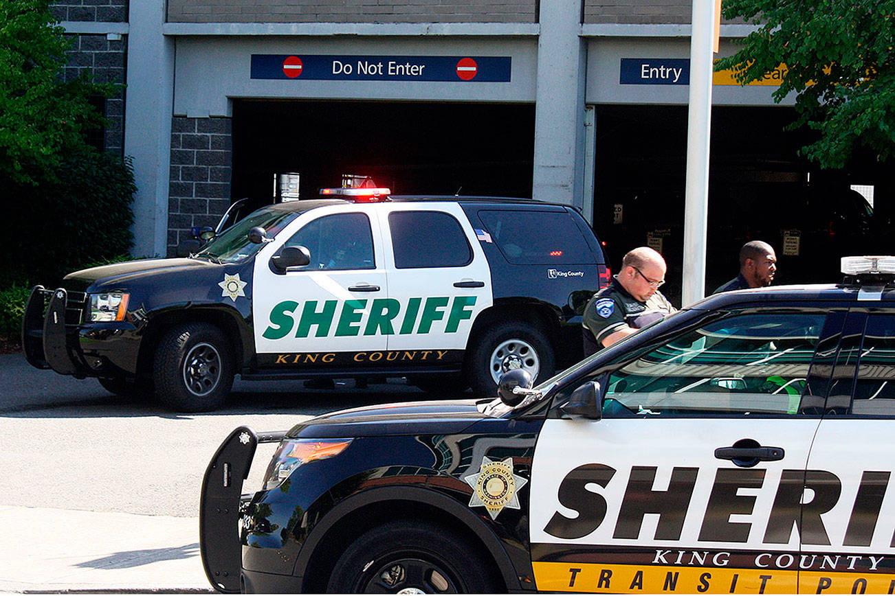 FILE PHOTO: King County Sheriff’s Office deputies block off access to the Kent Station parking garage after a deputy shot and killed a suspect in a reportedly stolen Honda Civic in 2018.