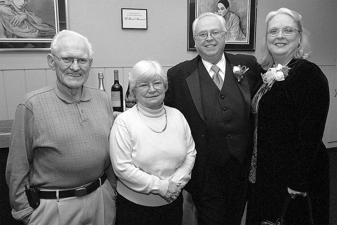 Former Auburn mayor Chuck Booth and his wife, Leila, left, with then Auburn mayor Pete Lewis and his wife, Kathy, at an event at the Auburn Avenue Theater in October 2007. REPORTER FILE PHOTO