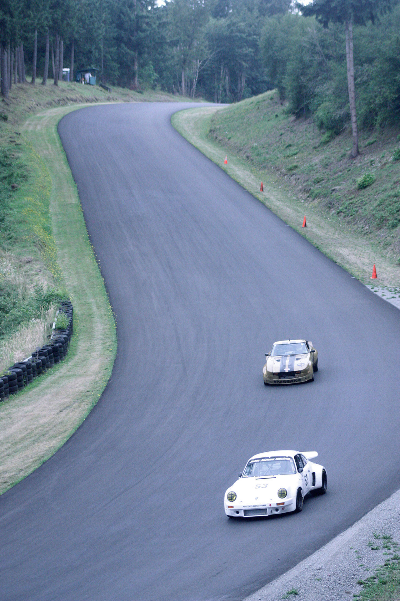 Classic Porsches dart down the backside of Pacific Raceways’ 2.25-mile road course during the 31st annual Pacific Northwest Historics (PNWH) vintage auto races July 7. MARK KLAAS, Kent Reporter