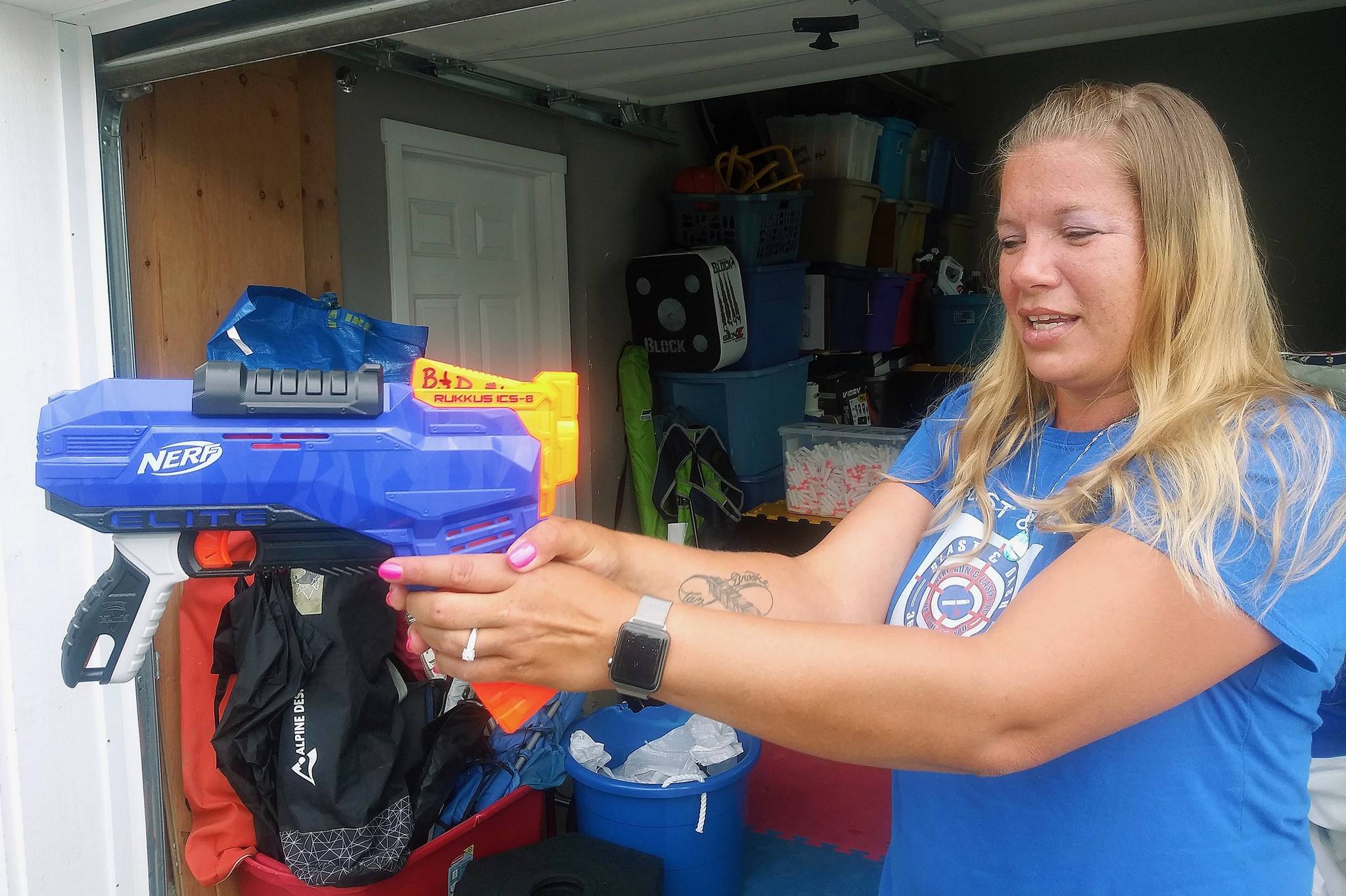 Angelica Roberts, owner of Blast and Dash, demonstrates how a skilled hand should hold a Nerf gun. ROBERT WHALE, Auburn Reporter