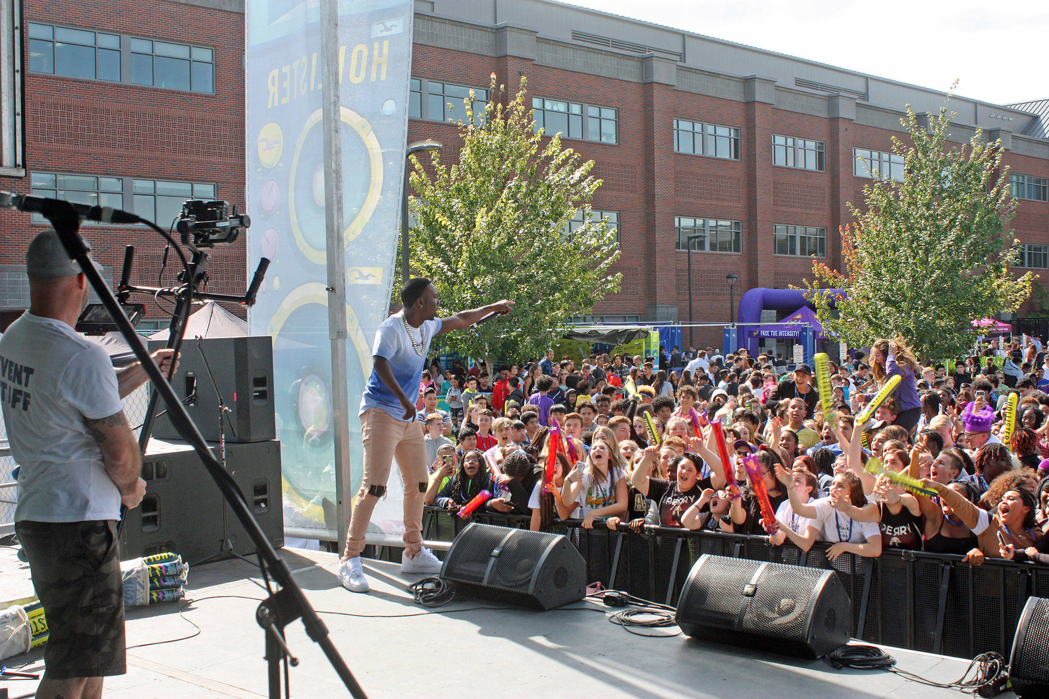 Baltimore-based Rapper Lil Key sings his heart out for all 1,700 of Auburn High School’s students Wednesday afternoon, Sept. 11, during a lunchtime performance on the school’s southeast parking lot. Lil Key was one of four acts that the California-based non-profit High School Nation brought to the high school last week. ROBERT WHALE, Auburn Reporter