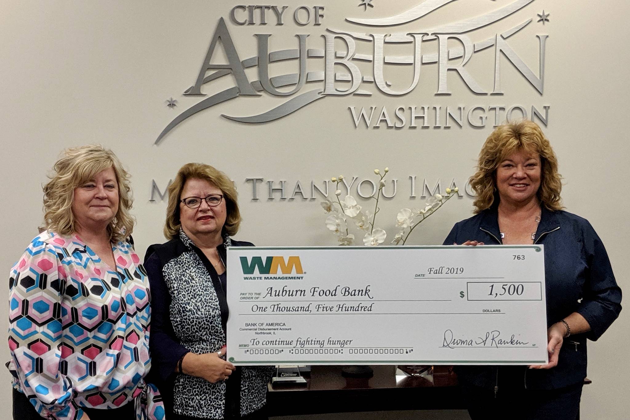 Waste Management presents a $1,500 check to the Auburn Food Bank in the community’s fight against hunger on Thursday at City Hall. From left, Laura Moser, municipal & community relations manager at Waste Management; Debbie Christian, executive director of the Auburn Food Bank; and Auburn Mayor Nancy Backus. COURTESY PHOTO, Waste Management