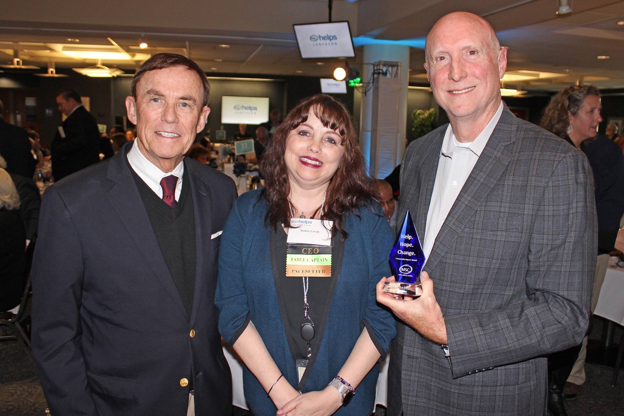 Honorary Chair Pete von Reichbauer and MSC President Robin Corak present former Orion Industries President and CEO John Theisen the first MSC Help, Hope, Change Award. COURTESY PHOTO