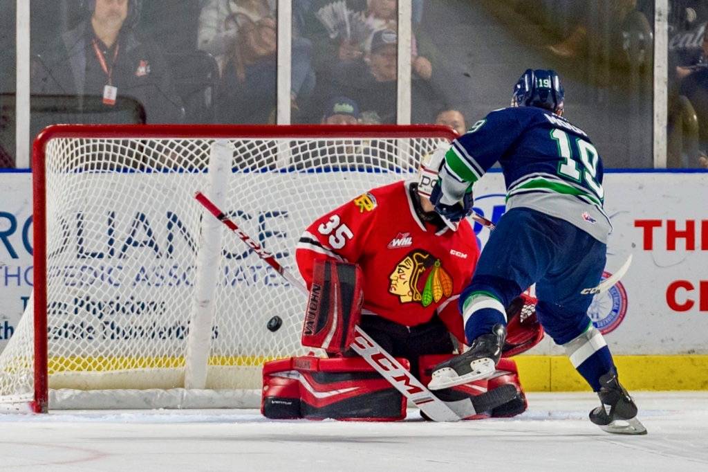 The Thunderbirds’ Peyton Mount flips the puck past Winterhaws goalie Isaiah DiLaura in the shootout Saturday. COURTESY PHOTO, Brian Liesse, T-Birds