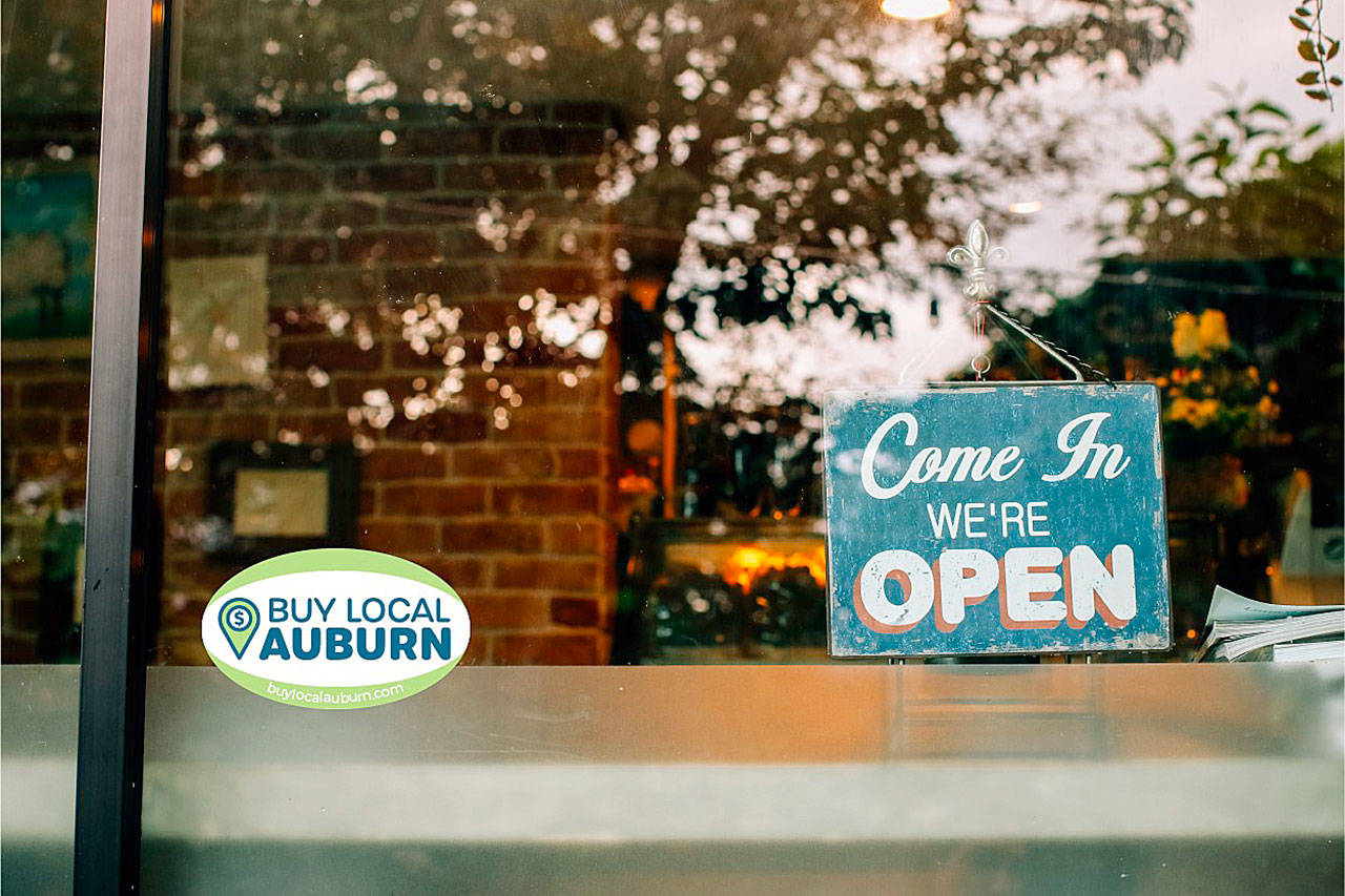This little decal has just found its way to the windows of Auburn businesses, of course, to encourage local shopping and to promote the new business website. COURTESY PHOTO