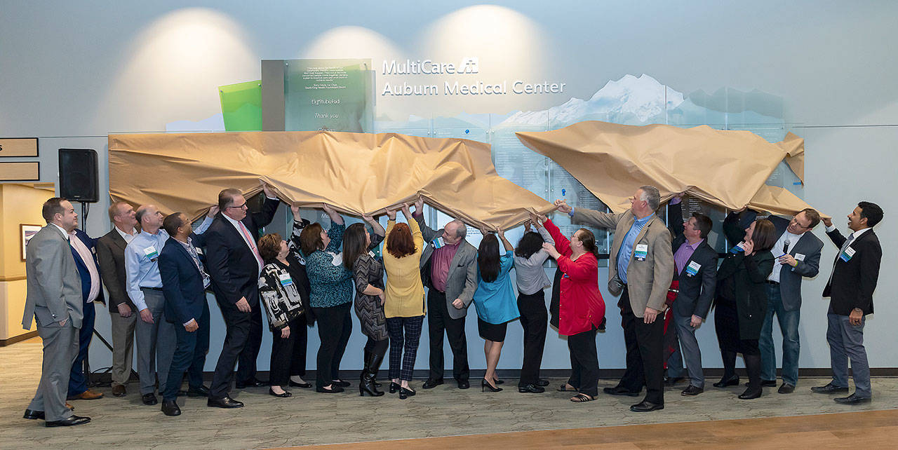 South King Health Foundation and MultiCare Auburn Medical Center leaders join community partners to unveil a donor wall in the lobby at the hospital during a ceremony Tuesday. COURTESY, Kristin Zwiers Photography