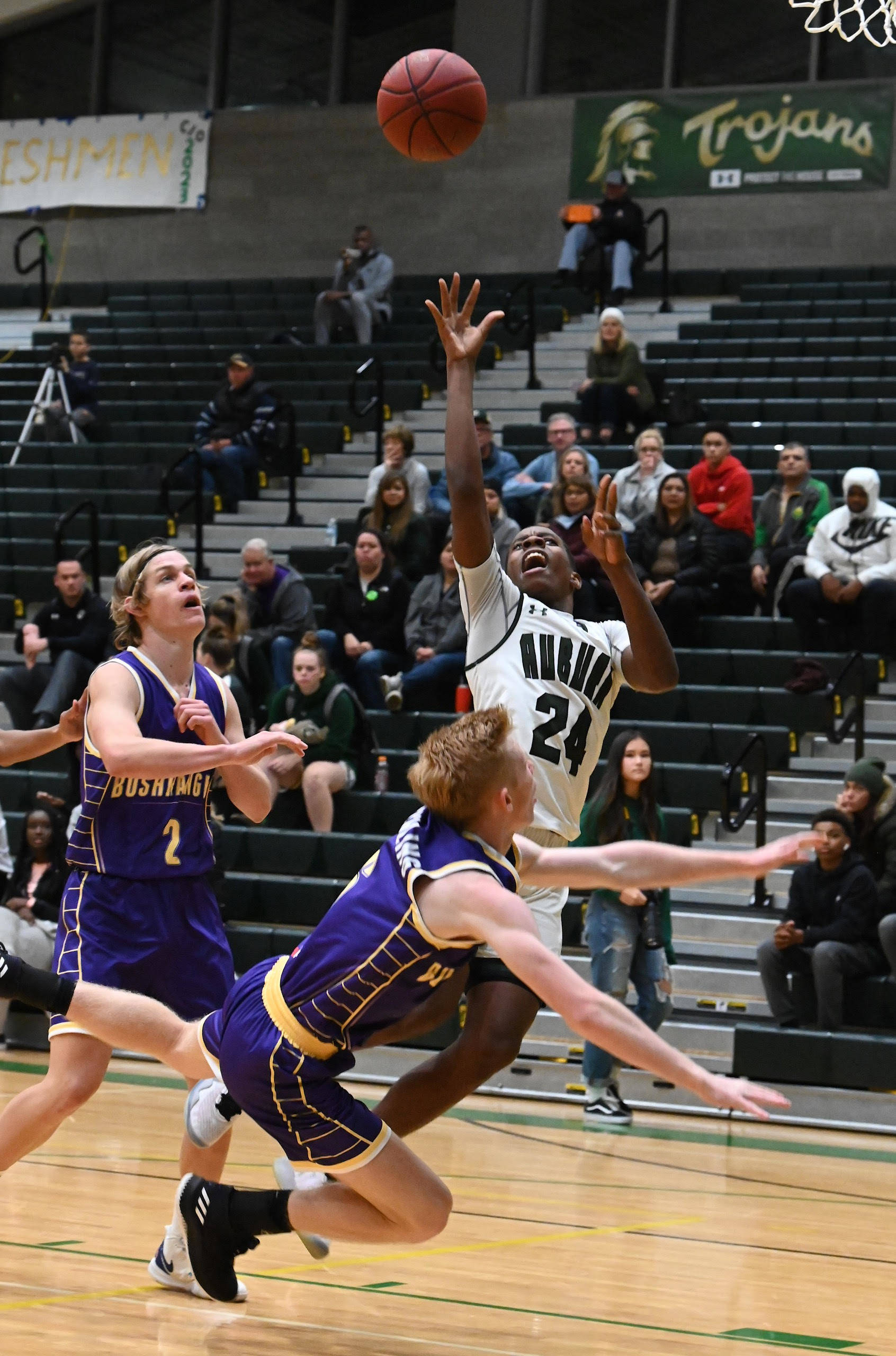 Auburn’s Dae’Kwon Watson drives past North East Bushrangers’ Hunter Gottschling during their game Tuesday night at Bob Jones Gymnasium. Watson scored a game-high 15 points in the Trojans’ 76-37 win over the visitors from Australia. RACHEL CIAMPI, Auburn Reporter