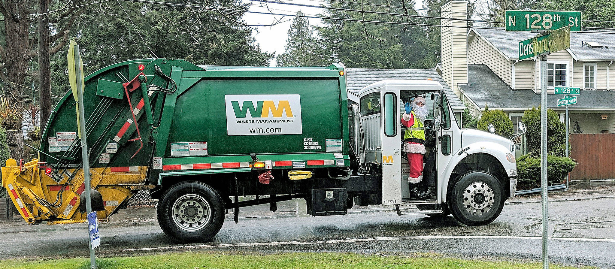 Saint Nic: Waste Management truck driver Nic Greer makes his rounds and spreads holiday cheer throughout Auburn neighborhoods. COURTESY PHOTO, WM