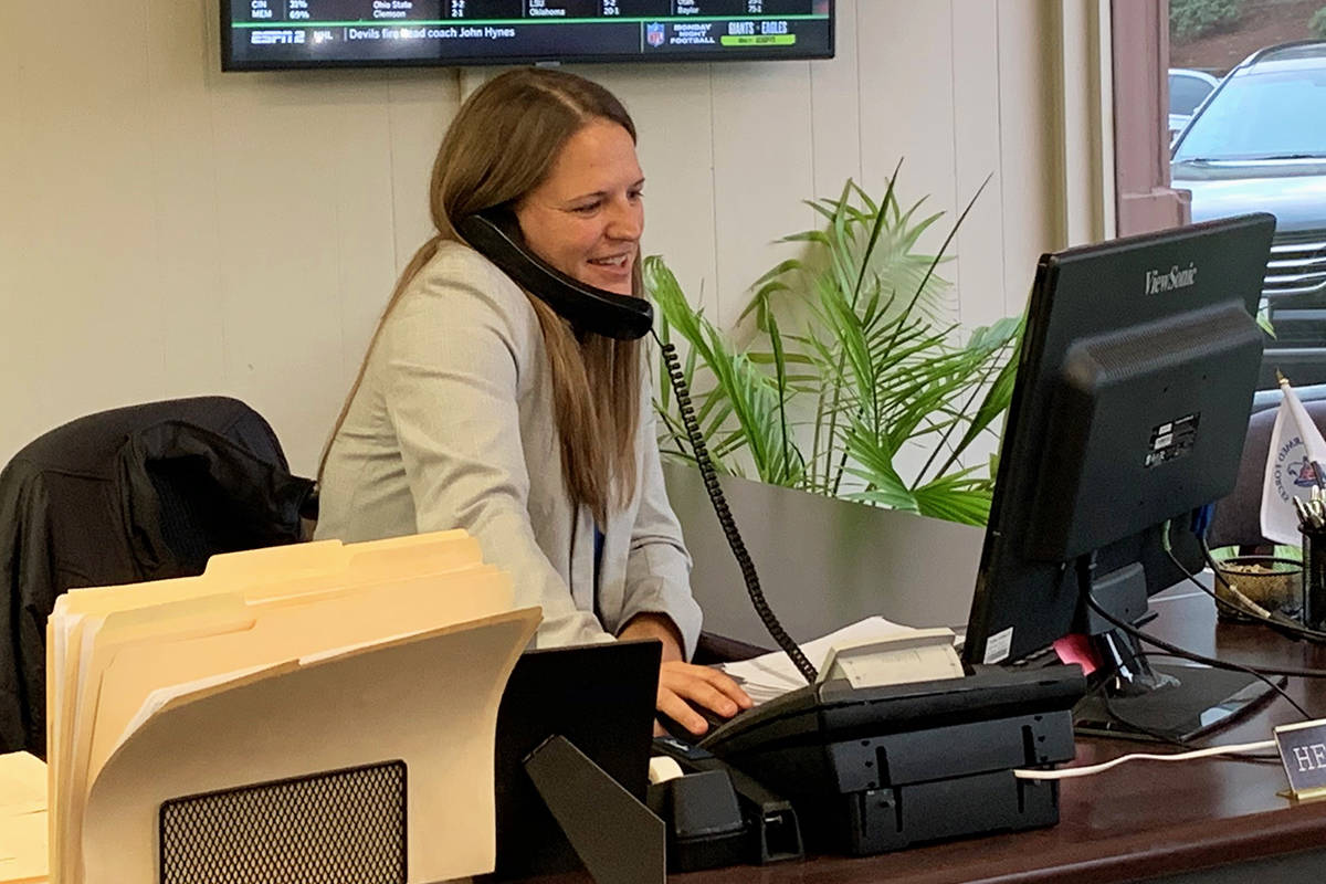 Courtney Wimer, bail bonds agent and office manager in Tacoma for All City Bail Bonds, goes above and beyond for her clients and their families. She takes seriously the company’s caring and people-focused philosophy. Photo by Mackenzie Schwartz