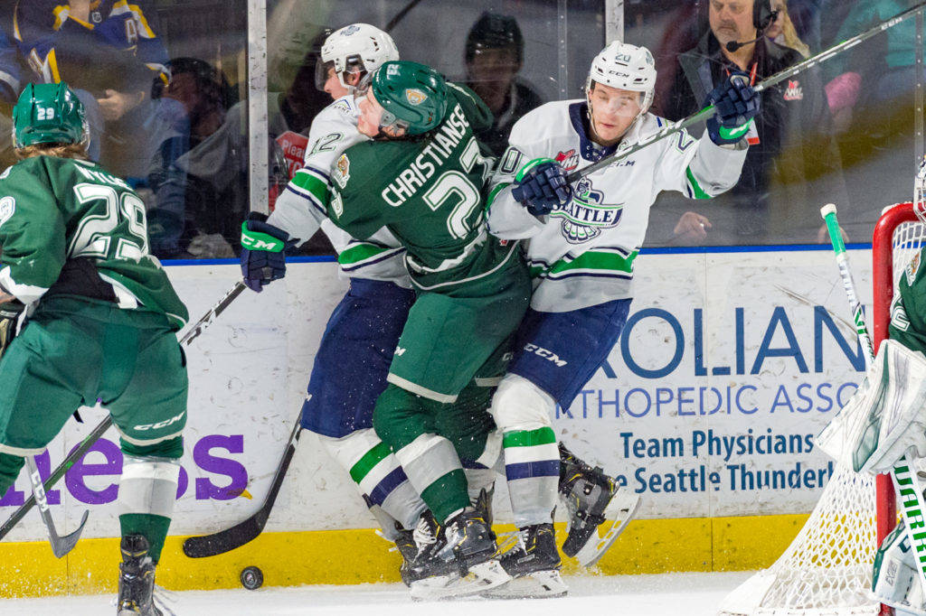 The Thunderbirds’ Henrik Rybinski, left, and Conner Bruggen-Cate sandwich the Silvertips’ Jake Christiansen during WHL play at the accesso ShoWare Center on Sunday. COURTESY PHOTO, Brian Liesse, T-Birds