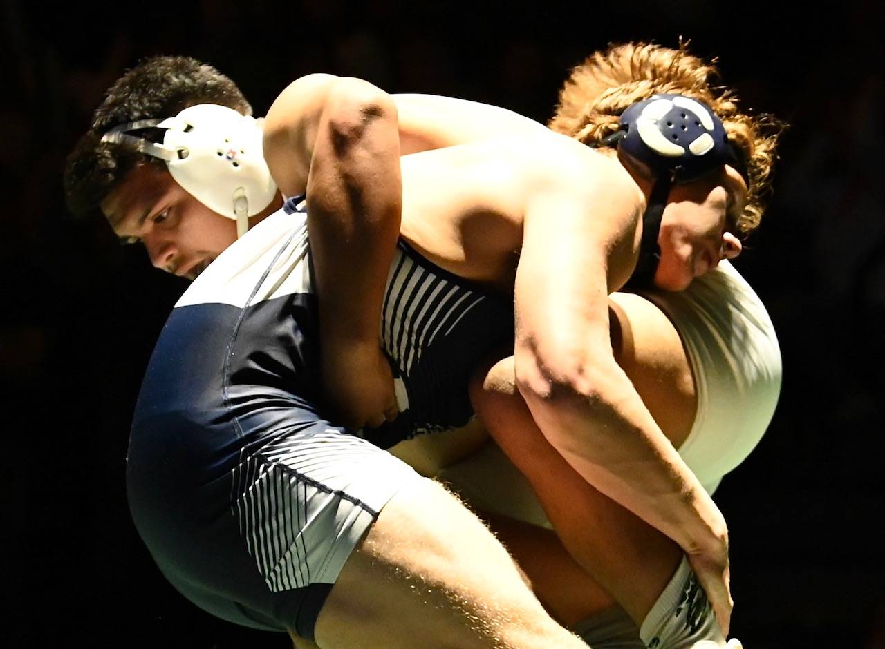 Auburn Riverside’s Christian Pedro, bottom and right, tangles with Auburn’s Uriel Parra during their 220-pound match on Jan. 23. Pedro won by fall at four minutes, 59 seconds. RACHEL CIAMPI, Auburn Reporter