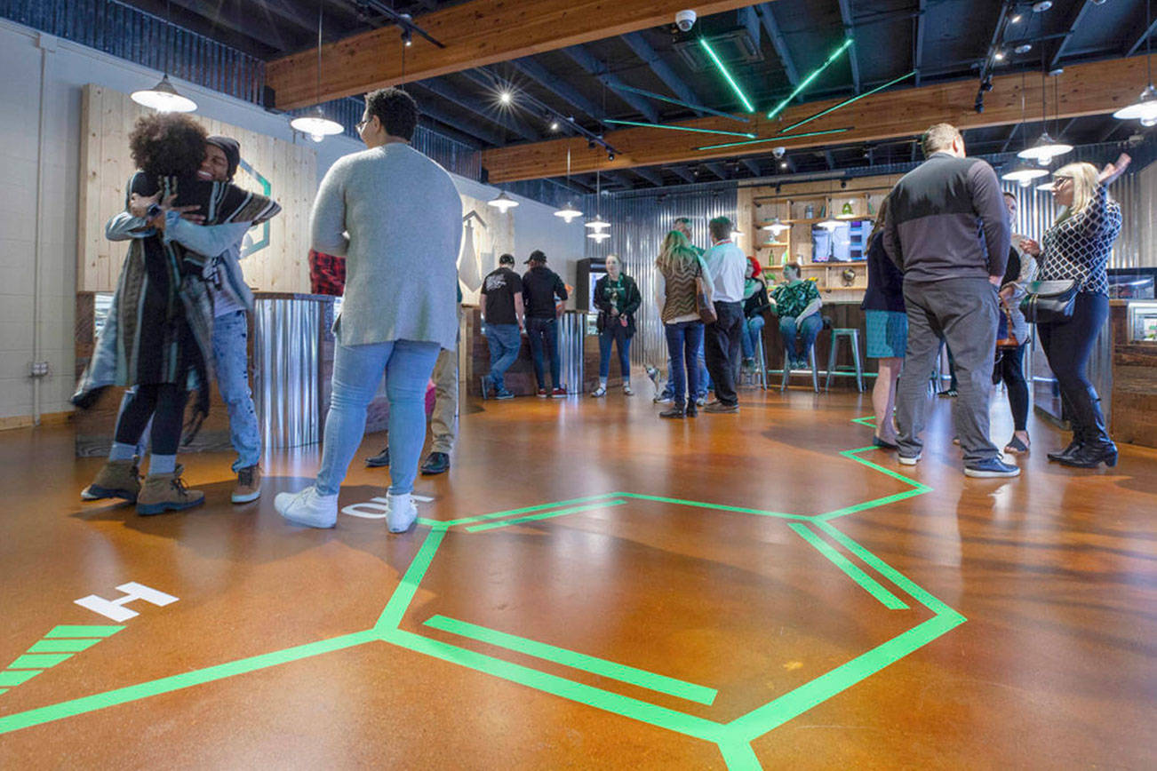 In this April 2019 file photo, locals celebrate The Evergreen Market’s grand opening in Kirkland’s Totem Lake neighborhood. The company also has cannabis retail shops in Auburn, Renton and Bellevue. Courtesy photo