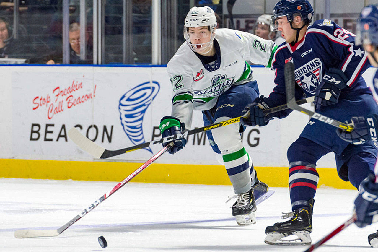 Seattle’s Luke Bateman battles for the puck Tuesday night against Tri-City’s Edge Lambert at the accesso ShoWare Center. COURTESY PHOTO, Brian Liesse, T-Birds