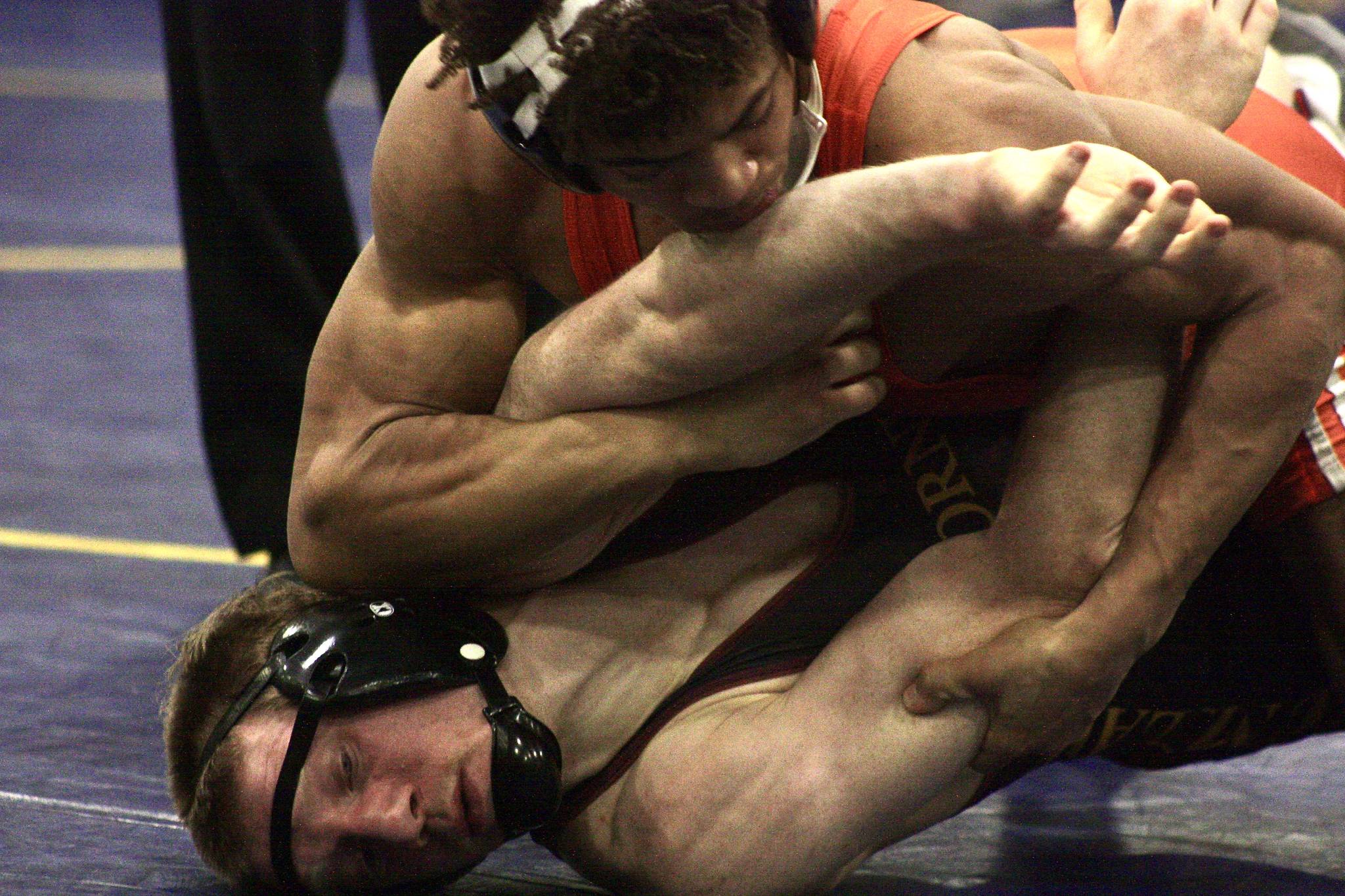 Auburn Mountainview’s Mahlik Walker ties up Enumclaw’s Aidan Carroll during their 138-pound regional finals bout at Tahoma High School in Maple Valley on Saturday. Walker took a 7-4 decision. MARK KLAAS, Auburn Reporter