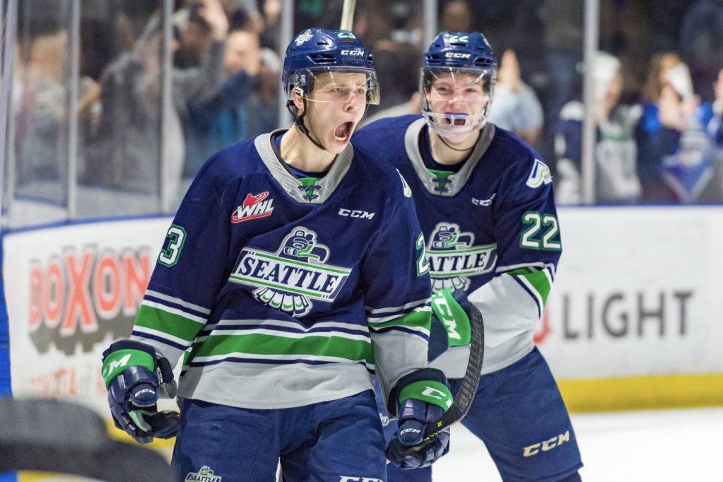 The Thunderbirds’ Brendan Williamson, left, celebrates his first career WHL goal with Luke Bateman on Saturday night. Williamson’s goal proved to be the game winner against rival Portland. COURTESY PHOTO, Brian Liesse, T-Birds