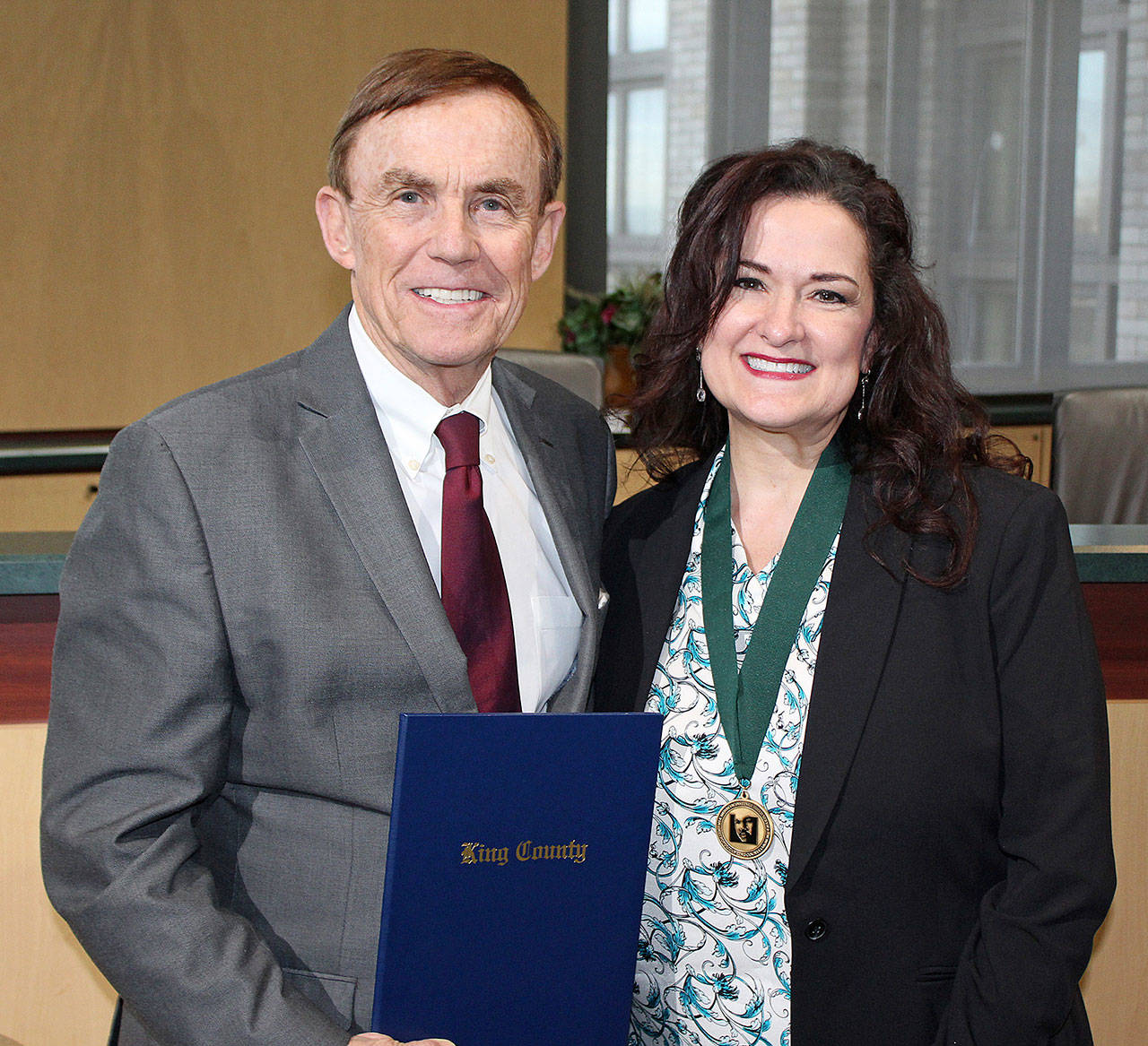 King County Councilmember Pete von Reichbauer presents Auburn’s Amy Hatcher with the Martin Luther King Medal of Distinguished Service during a ceremony Tuesday. Amy and her husband John were honored for their work in the community. COURTESY PHOTO