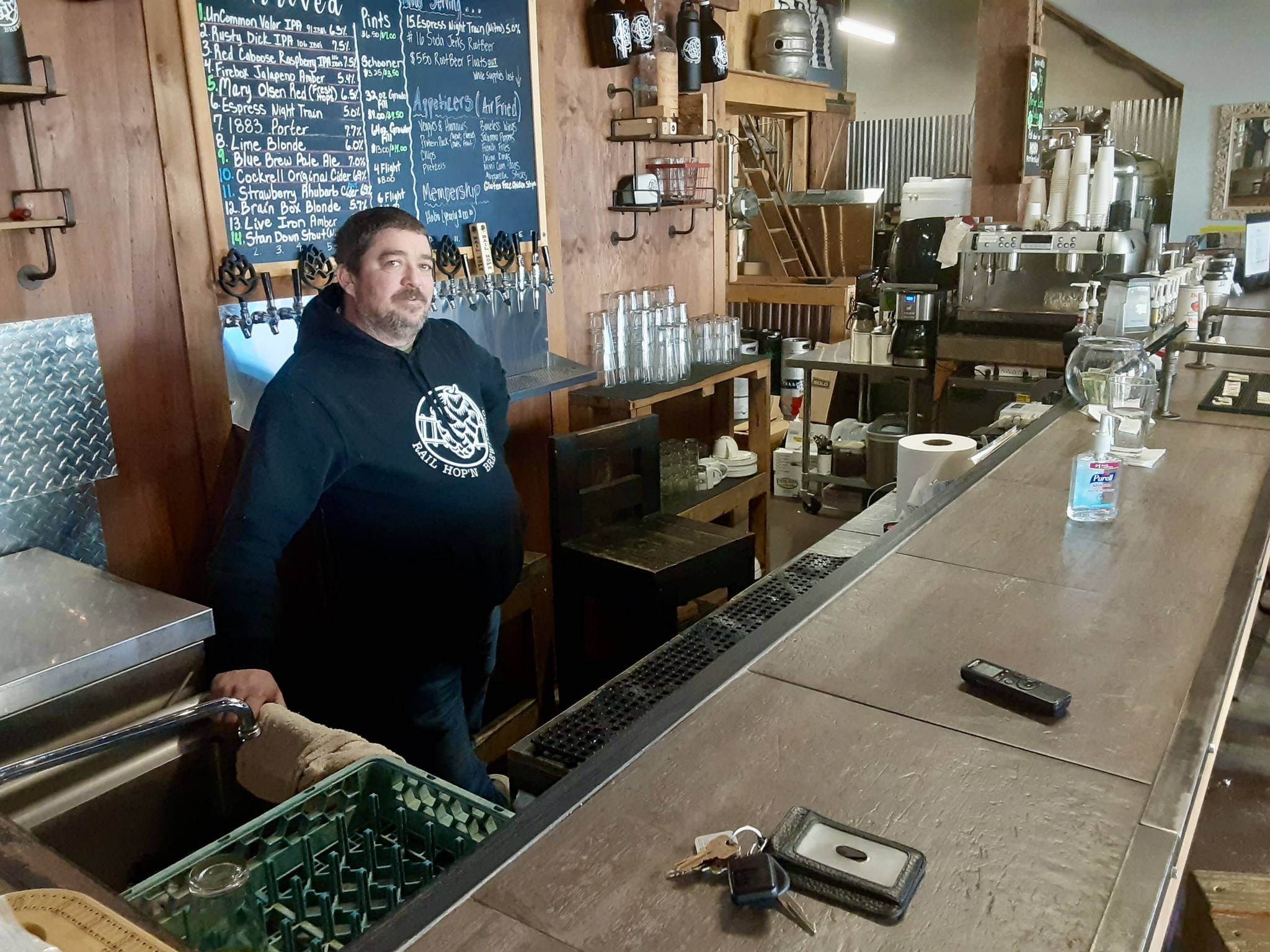 William ’Billy Jack’ Newman tends to a quiet bar at the Rail Hop’n Brewing Co. on Auburn’s West Main Street. The coronavirus pandemic has hurt many downtown small businesses. ROBERT WHALE, Auburn Reporter