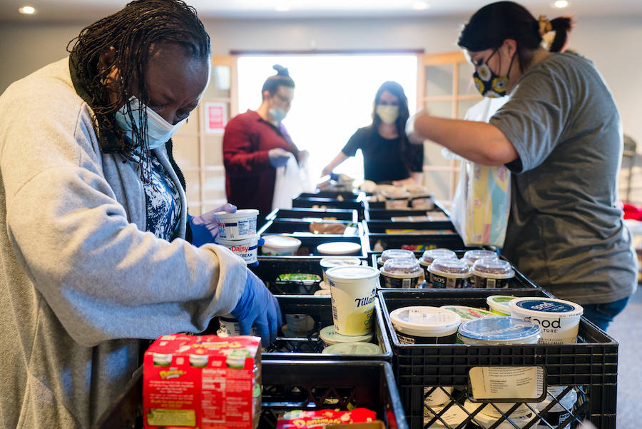 A volunteer team at Overcomer Covenant Church pre-bags groceries Thursday afternoon. Courtesy photo