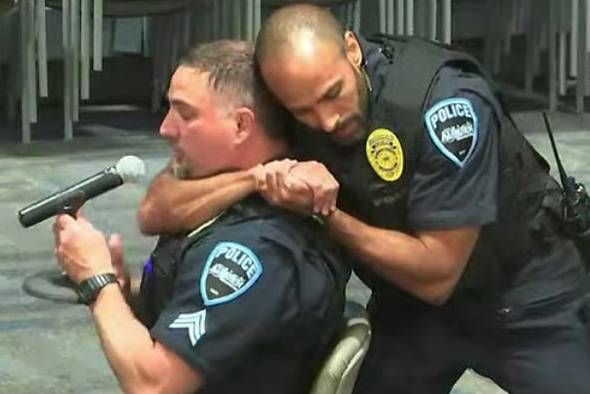 Screenshot                                 Auburn Police Cmdr. Cristian Adams demonstrating the VNR on Sgt. James Frith at the Auburn City Council meeting.